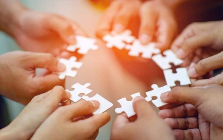 hands hold puzzle cards hands hold puzzle cards