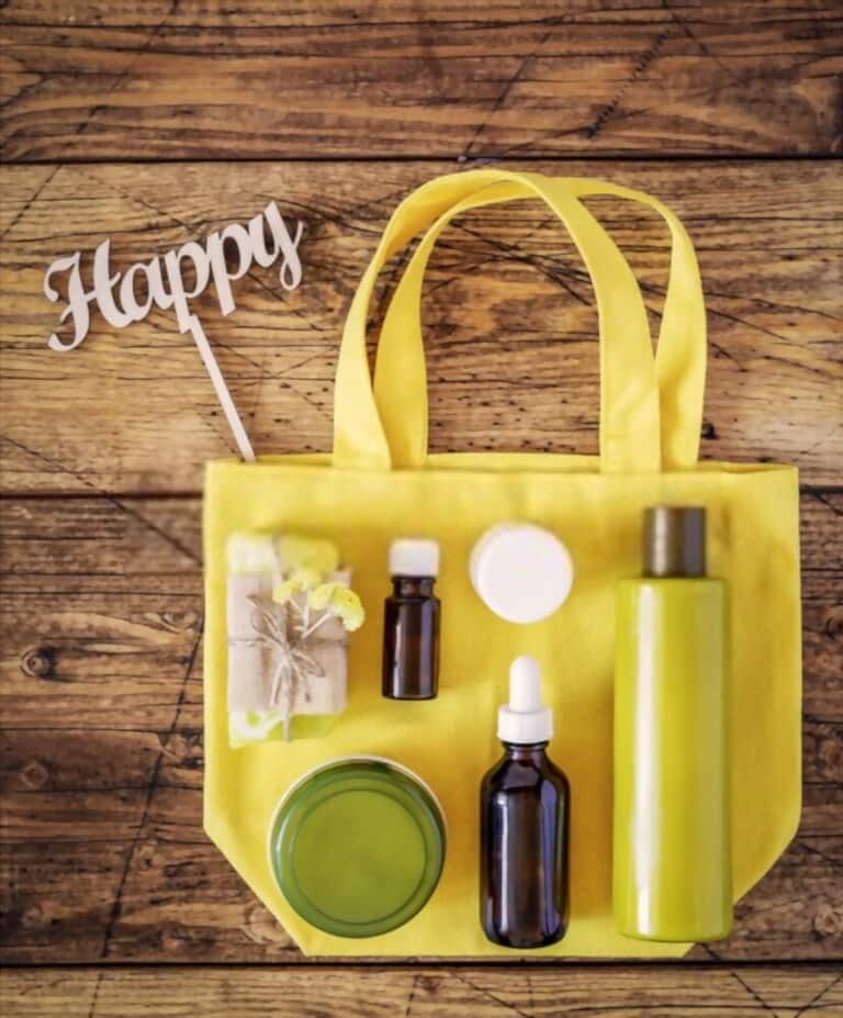 Yellow cotton bag with natural cosmetic products on wooden background Yellow cotton bag with natural cosmetic products on wooden background