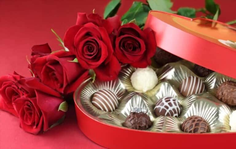 an everlasting bouquet of red roses and a box of decadent chocolate an everlasting bouquet of red roses and a box of decadent chocolate