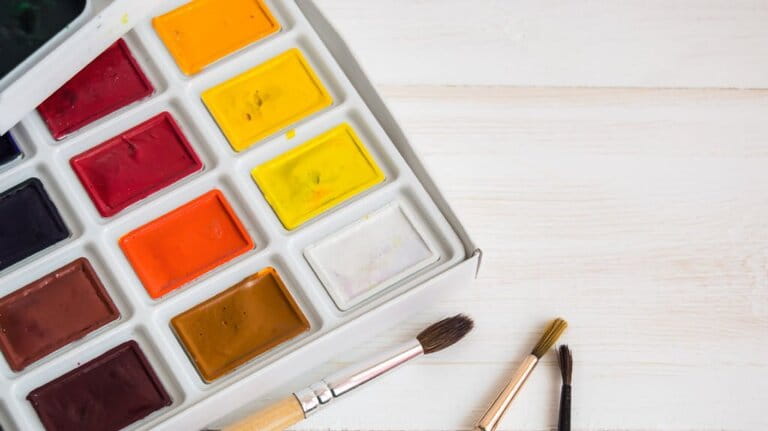 Watercolor paint with brush isolated on empty space