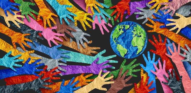 International diversity or international world earth and culture day as a concept of diversity and crowd cooperation symbol as diverse hands held together on planet earth.