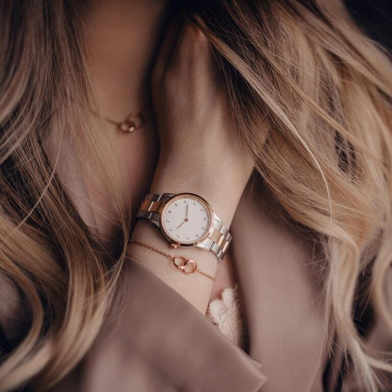 Stylish white watch on woman hand Stylish white watch on woman hand