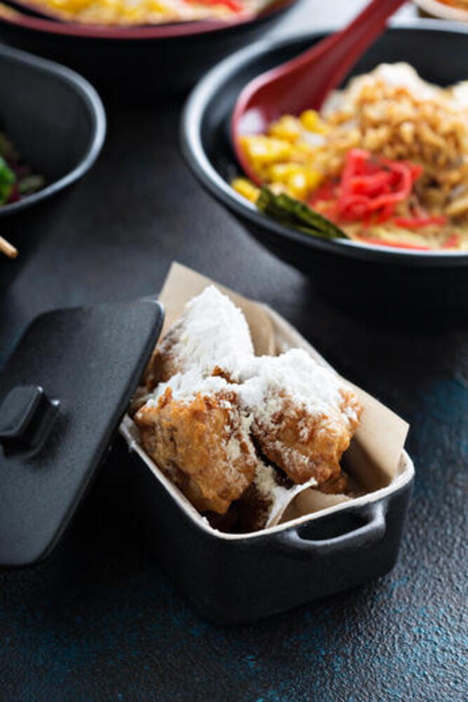 Asian style fried donuts with powdered sugar Asian style fried donuts with powdered sugar