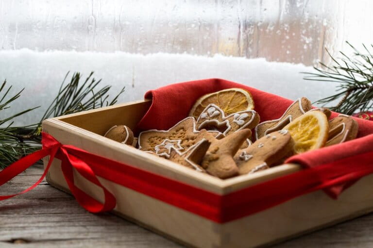 Christmas greeting card with gingerbread cookies and xmas gift box