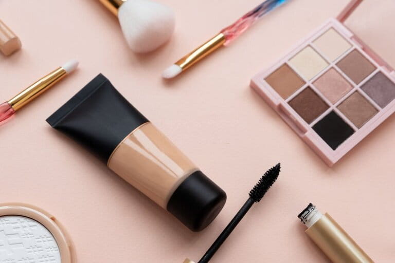 Close-up of cosmetics and accessories set on pink background. Copy space. Lie flat. Top view. Skin care or morning routine concept