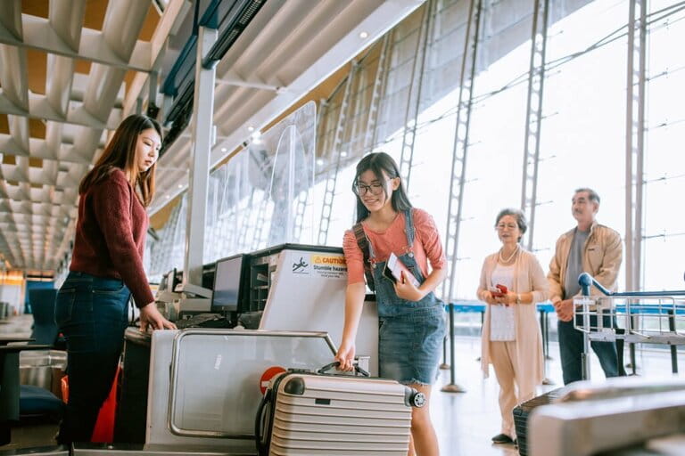 The family checks in for a trip at the airport The family checks in for a trip at the airport
