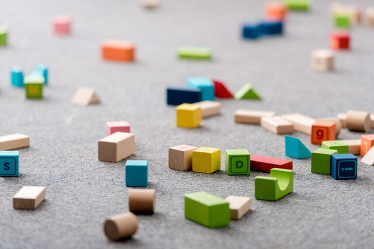 Colourful toy cubes and alphabet blocks Colourful toy cubes and alphabet blocks