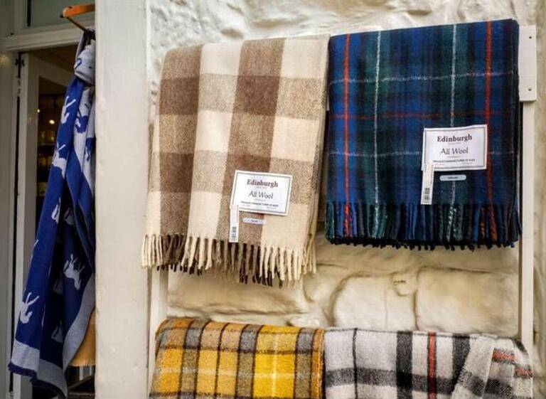 Tartan Scarves for sale outside a gift shop on Victoria Street, Edinburgh. Tartan Scarves for sale outside a gift shop on Victoria Street, Edinburgh.